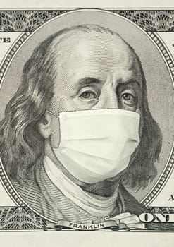Portrait of Franklin on 100 dollar banknote with medical mask. The concept of coronavrius epidemic and the financial crisis caused by this collapse