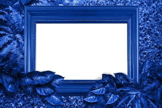 Classic blue color background from leaves and white blank for your design or text. Pantone color of the year 2020.