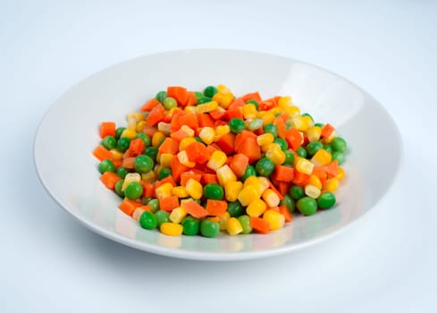 Organic Food. Mixed Vegetables Isolated White Background. Vegetable containing carrots, peas, and corn on white background, Healthy food, Colorful mixed vegetables.