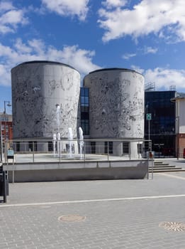 Lodz, Poland - May 4, 2023: EC1 Science and Technology Center, cooling towers with wall mural. New Center is next to the Lodz Fabryczna Railway Station