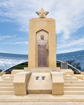 Baku, Azerbaijan - May 6, 2024: The Hazi Aslanov Monument stands tall in front of the entrance to the Funicular
