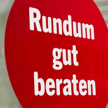 Sticker on a shop window with the german inscription Rundum gut beraten. Translation: Good advice all round