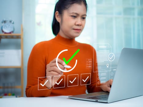 Businesswoman using a laptop. Online survey with digital forms and checklists, Technology and strategy for success in the business modern world, Transparency in organizations and companies.