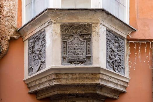 Innsbruck, Austria - February 26, 2023: Decorative facade of Prechthaus, medieval tenement house located at Pfarrgasse street