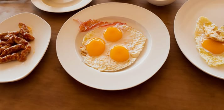 Morning breakfast, ham and eggs arranged  on the table from top view