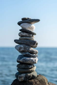 balanced stones on the rocks of the sea
