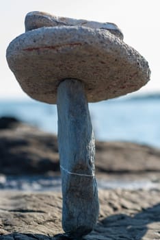 balanced stones on the rocks of the sea