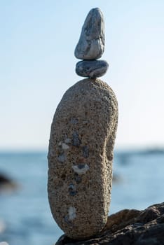 balanced stones on the rocks of the sea