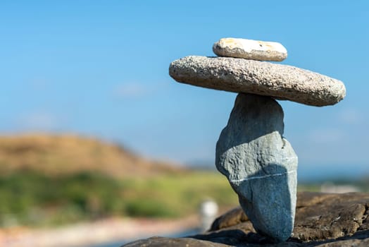 balanced stones on the rocks of the sea