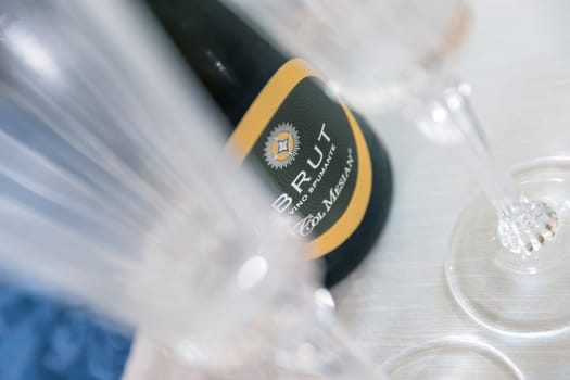 Aperitif in restaurant party with friends, champagne celebration. Bergamo, ITALY - May 25, 2024.