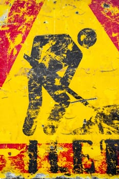 Men at work road sign. Warning of construction works ahead. Grunge look.