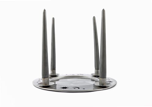 Tin plate as a candleholders on a white background