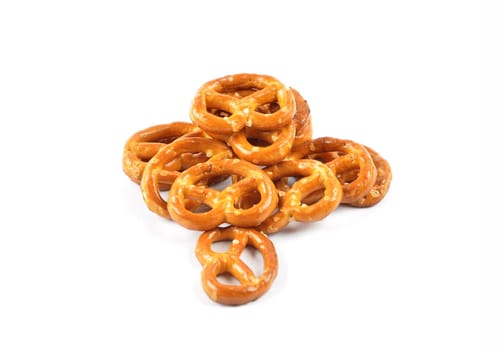 Hearty salty pretzels as a snack on a white background