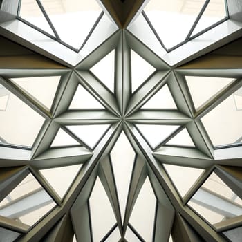 The image features a striking ceiling with a geometric pattern, highlighting sharp angles and a modern aesthetic. Natural light filters through, enhancing the intricate structure above.