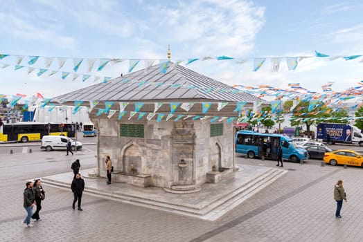 Istanbul, Turkey - May 5, 2023: Fountain of Ahmed III, or Ahmet Cesmesi, an 18th century public water fountain, or Sabil, built by Sultan Mahmud III, suited at Uskudar District