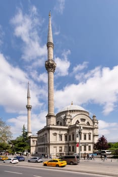 Istanbul, Turkey - May 7, 2023: View from Meclis-i Mebusan Street overlooking Baroque style Dolmabahce Mosque, suited at the waterside of Kabatas, in Beyoglu district