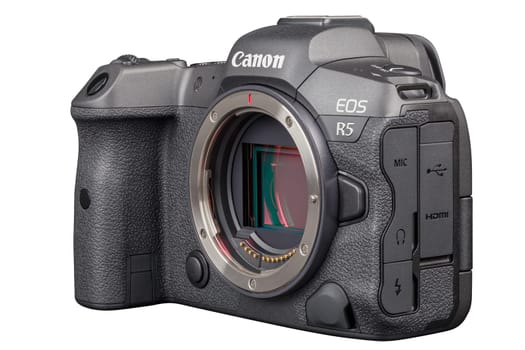 Canon R5 - black professional 35mm full-frame mirrorless camera body with flip screen isolated on white background with focus stacking - Tula, Russia, September 15, 2021