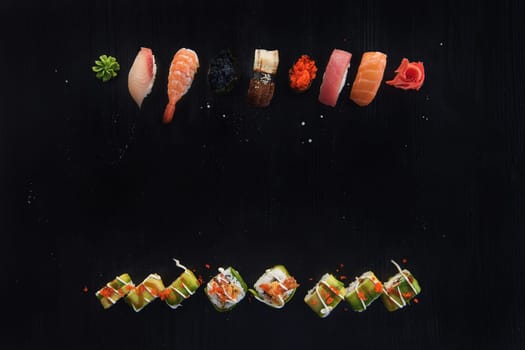 Various kinds of sushi served on wood black table. Concept of sushi menu for Japanese food