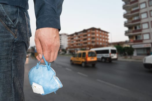 A man in the city with medical mask to protect against viruses. Closeup photo. Coronavirus pneumonia or flu concept