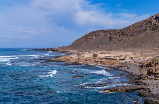 Gran Canaria, Spain: March 3, 2024: People at el Confital beach on the edge of Las Palmas, La Isleta peninsula. Gran Canaria, Spain