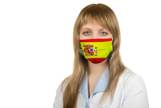 Closeup of a female healthcare professional nurse wearing a protection mask with Spain flag