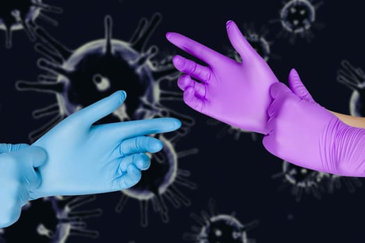 Male and female hand in protective gloves on corona virus COVID-2019 background. Concept of social distance, isolation, quarantine
