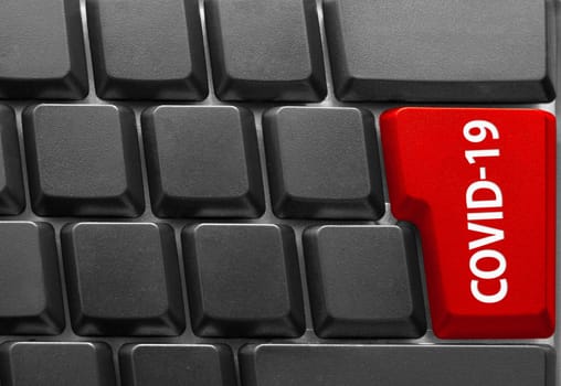 Close-up of Computer keyboard, with COVID-19 key