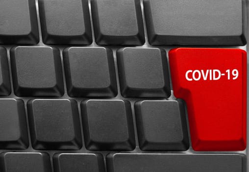 Close-up of Computer keyboard, with COVID-19 key