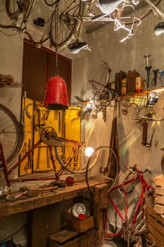 Old bicycle repair shop. Fixing mechanic issues in a garage, bike maintenance