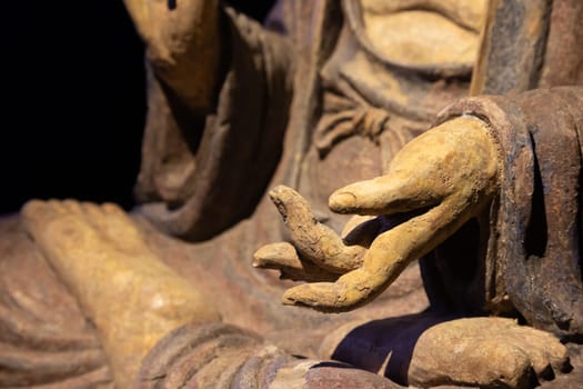 Ancient Buddha hand. Concept of energy, ethnic, harmony, meditation, peace