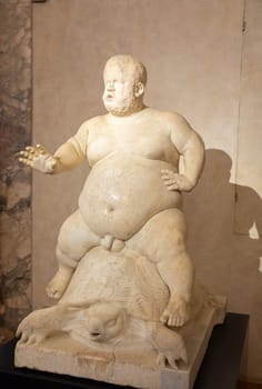 Florence, Italy - 28 December 2023: Morgante riding a tortoise, marble statue by Valerio Cioli, 1568. The dwarf Morgante belonged to the Medici family entourage. Original sculpture located in Boboli Gardens.