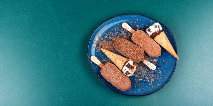 Chocolate ice cream on stick. Eskimo on stick ice cream in chocolate glaze with nuts. Close up.