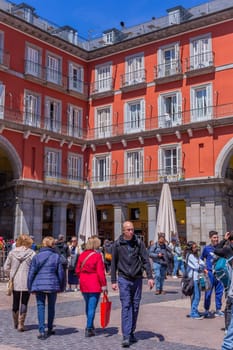 Madrid, Spain: April 24, 2024: The tourists at the Plaza Mayor or Main Square, a central plaza in the city of Madrid, Spain.