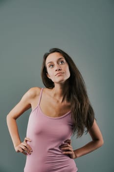 Woman in a pink shirt looking at the camera
