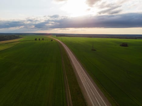Top view of the road in summer evening. View from drone