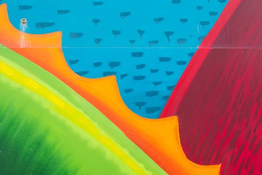 Abstract detail of color graffiti painted on the wall