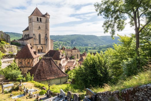 Old cliffside village of Saint-Cirq-Lapopie and Saint-Cirq-et-Sainte-Juliette church in the Occitanie region of South West France