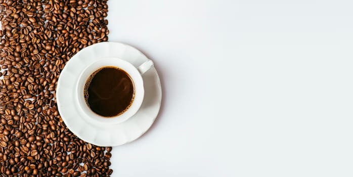 Top view of coffee cup on coffee bean texture and white background. Minimal art design layout. Restaurant cafe shop creative menu.