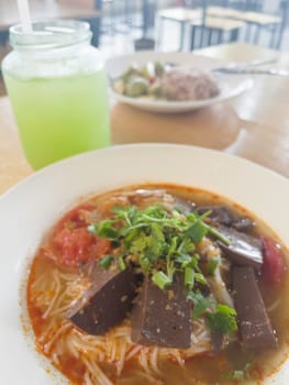 Noodles rice vermicelli with northern thai curry sauce, stock photo