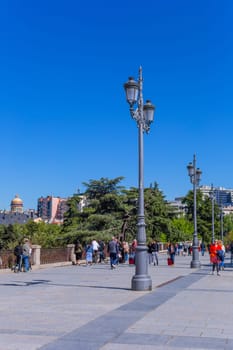 Madrid, Spain: April 24, 2024: Tourists at the Royal Palace in Madrid, Spain. Royal Palace of Madrid - is official residence of Spanish Royal Family. Madrid, Spain
