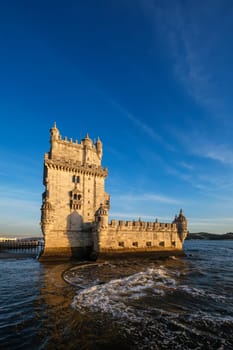 Belem Tower or Tower of St Vincent - famous tourist landmark of Lisboa and tourism attraction - on the bank of the Tagus River Tejo on sunset. Lisbon, Portugal