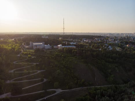Aerial top vew of winding road in the city, drone shot