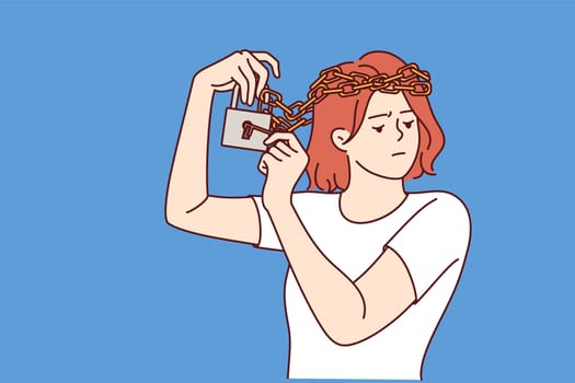 Woman with mental disorder and chain on head is trying to free herself from mental shackles. Girl psychological problems are caused by poor self-esteem and bullying or discrimination from others