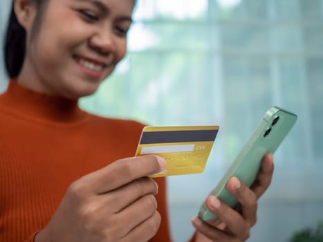Online banking transaction concept, Happy woman with credit card using smart phone and shopping online, Ecommerce and secure mobile banking concept, Making online payments.