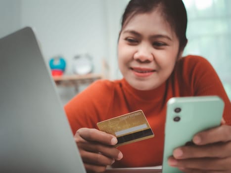 Online banking transaction concept, Happy woman with credit card using smart phone and shopping online, Ecommerce and secure mobile banking concept, Making online payments.
