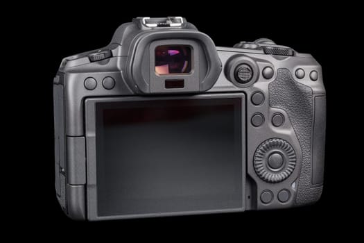 black 2020s professional 35mm full-frame mirrorless camera body with flip screen isolated on black background.
