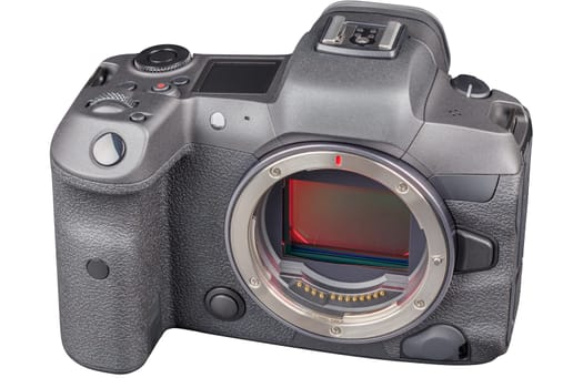 black 2020s professional 35mm full-frame mirrorless camera body with flip screen isolated on white background.