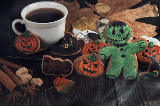 Ginger biscuits for Halloween holiday on wooden table with copy space