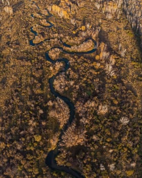 Aerial drone view of autumn landscape with river.