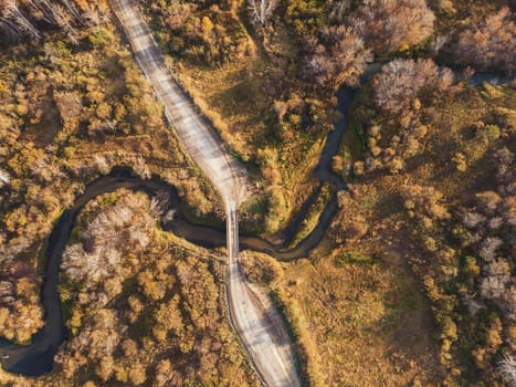 Aerial drone view of autumn landscape with river.